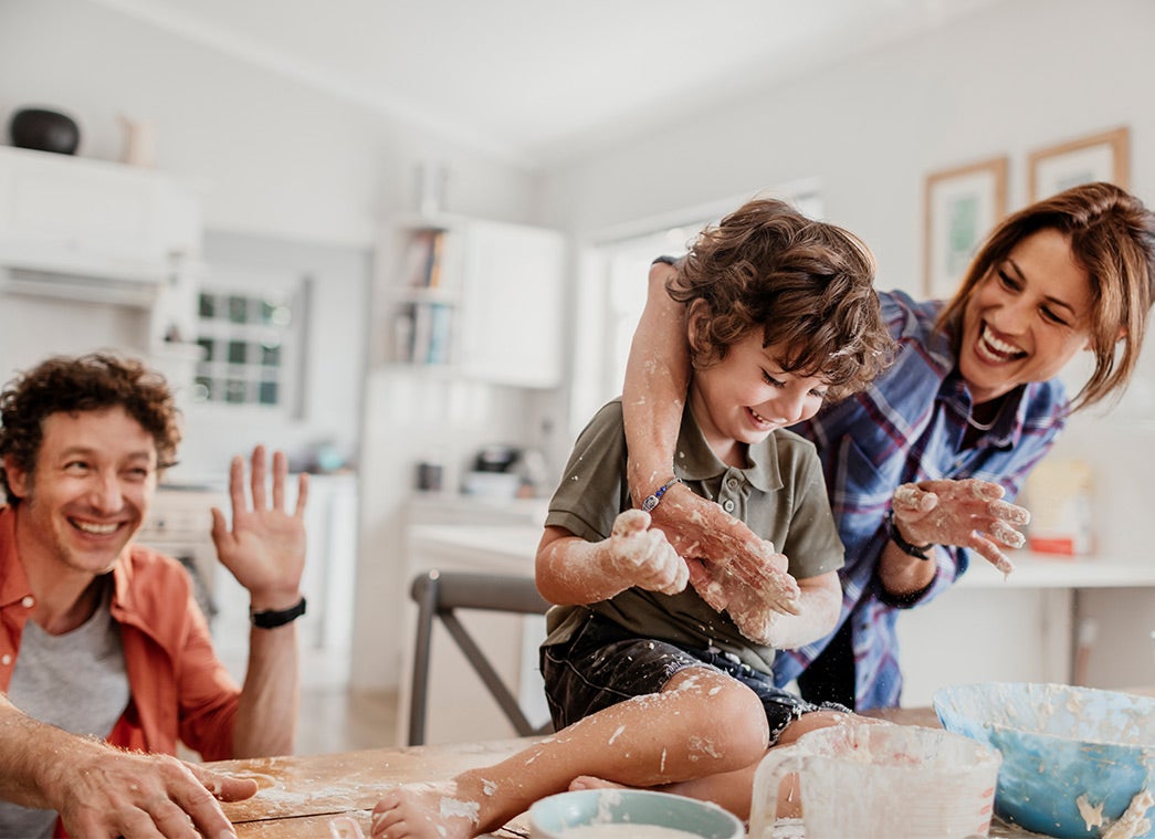 Family playing and making a mess in the kitchen 